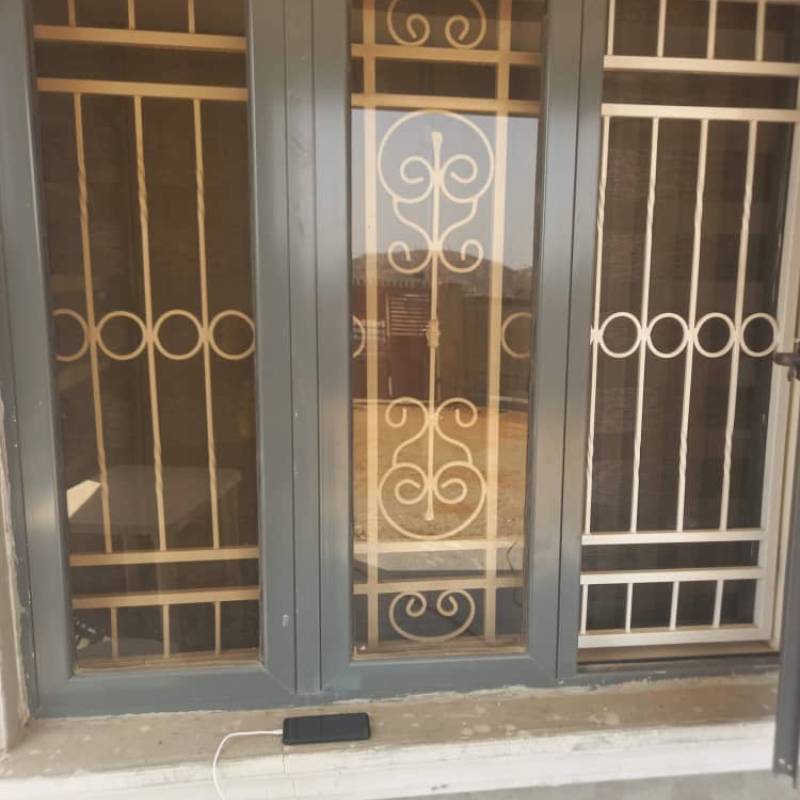 Elegant Black Ornate Window Protectors with Decorative Scrolls