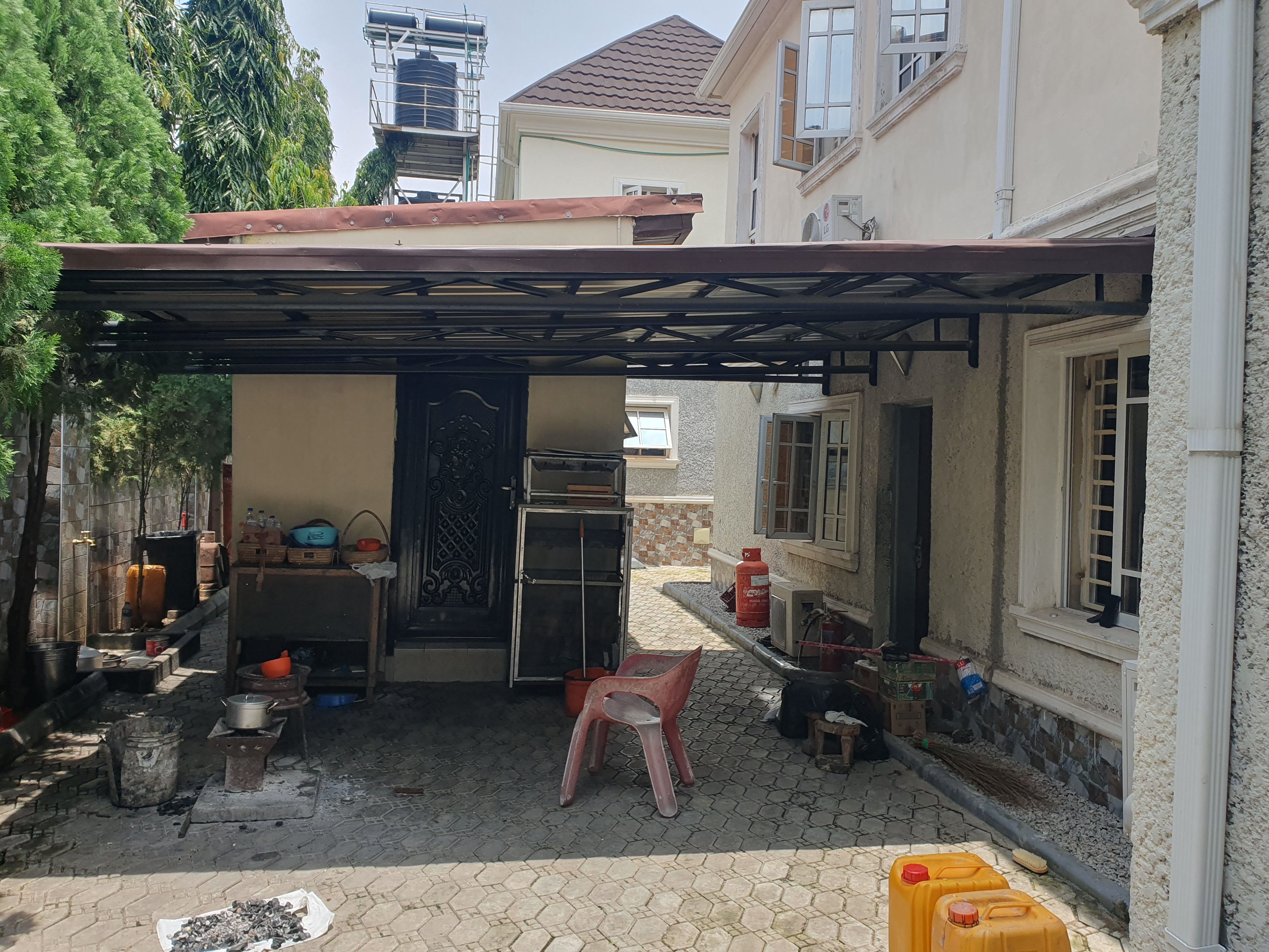 Heavy-Duty Black Steel Carport & Outdoor Kitchen Canopy – Functional Shade & Utility Structure