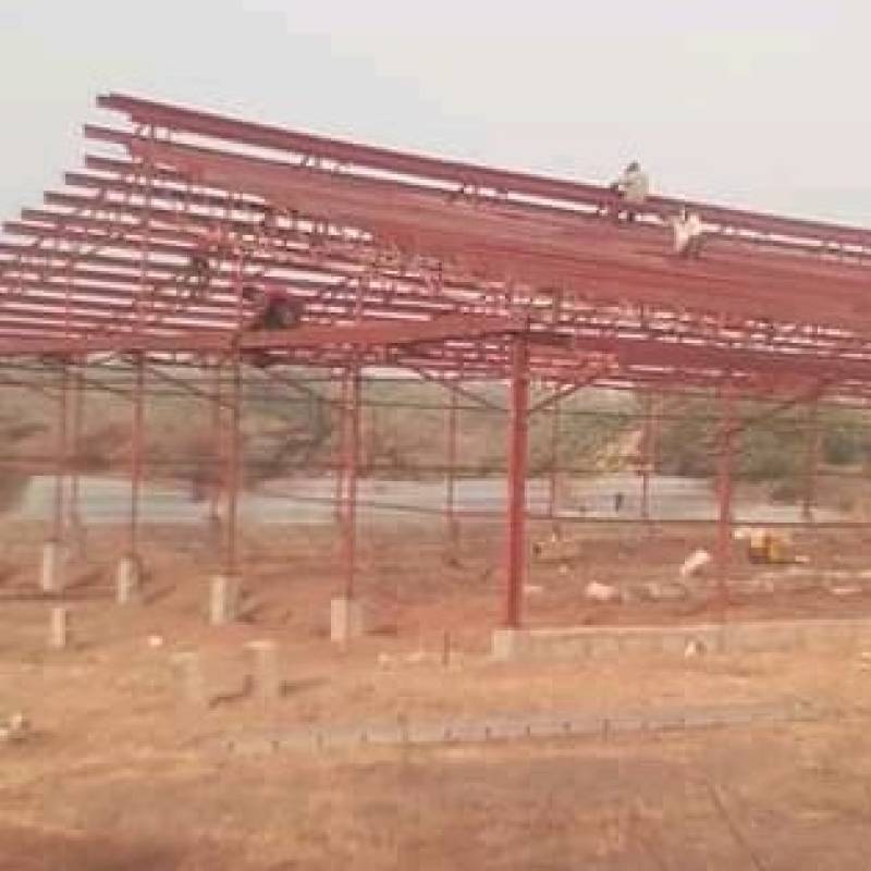 Large-Scale Red Steel Roof Truss System
