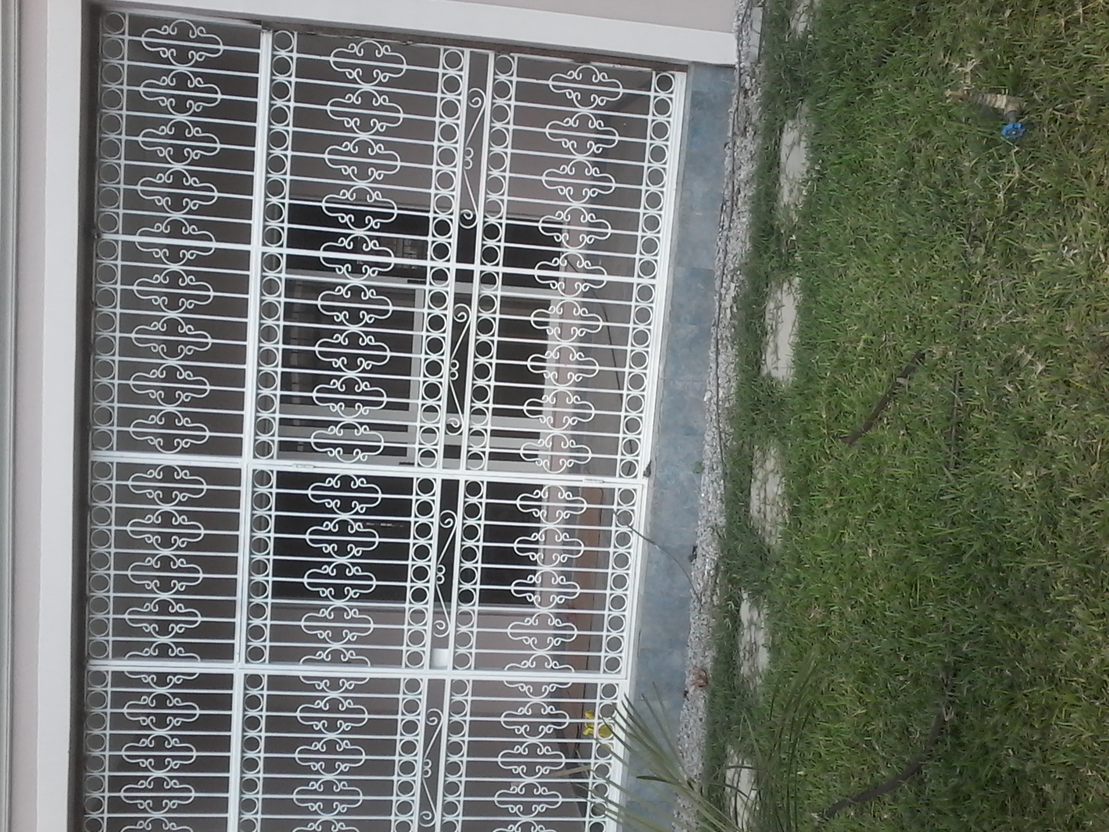 Ornamental White Scroll-Design Security Grille – Full-Width Sliding Door Protection