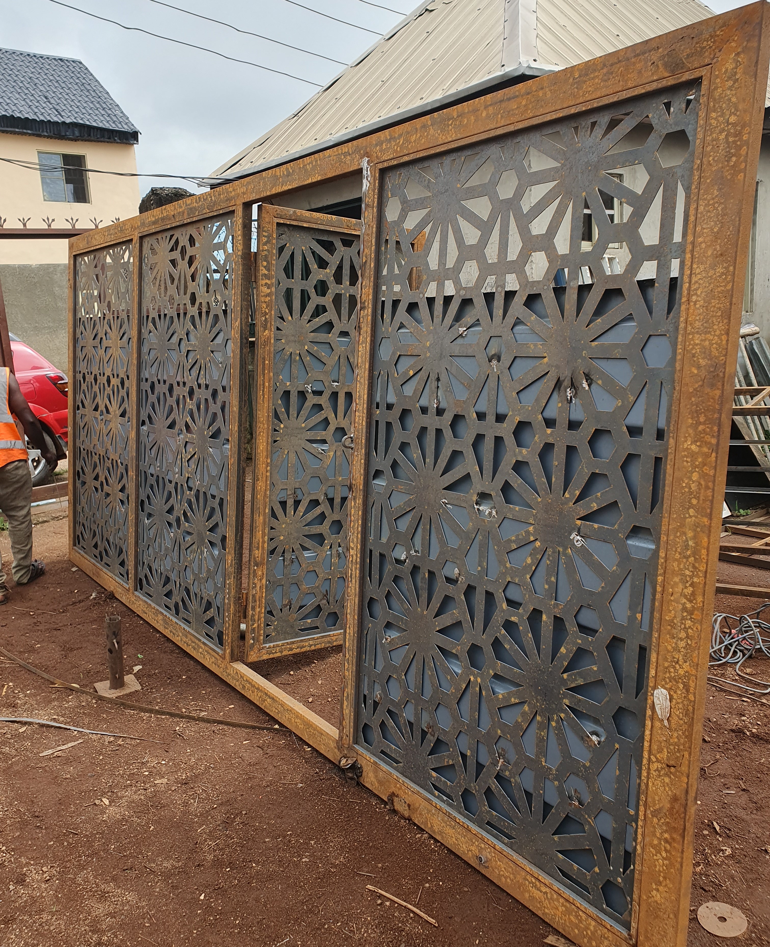 Ornate Laser-Cut Steel Security Gate with Starburst Pattern
