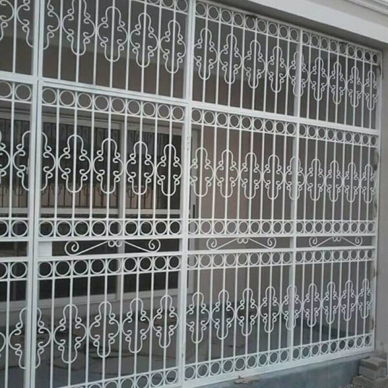 Ornate White Steel Security Window Grilles with Decorative Scroll Design