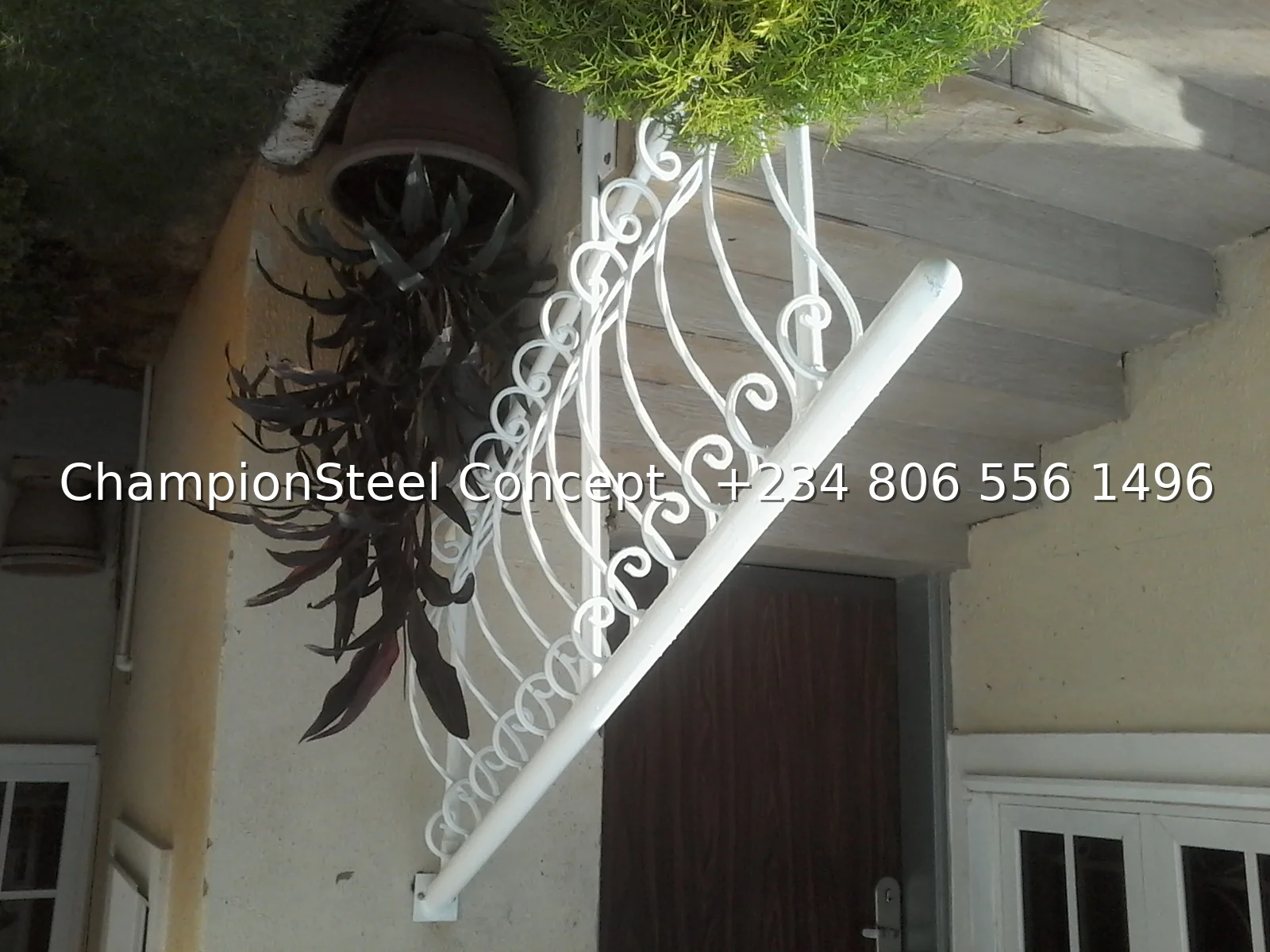 Ornamental Scroll Handrail for Entry Steps – White Powder-Coated Flowing Loop Design